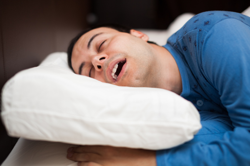 Man sleeping soundly in his bedroom, snoring